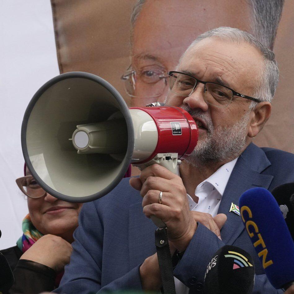 Expelled South African ambassador returns home and says will wear US sanction as 'badge of dignity'